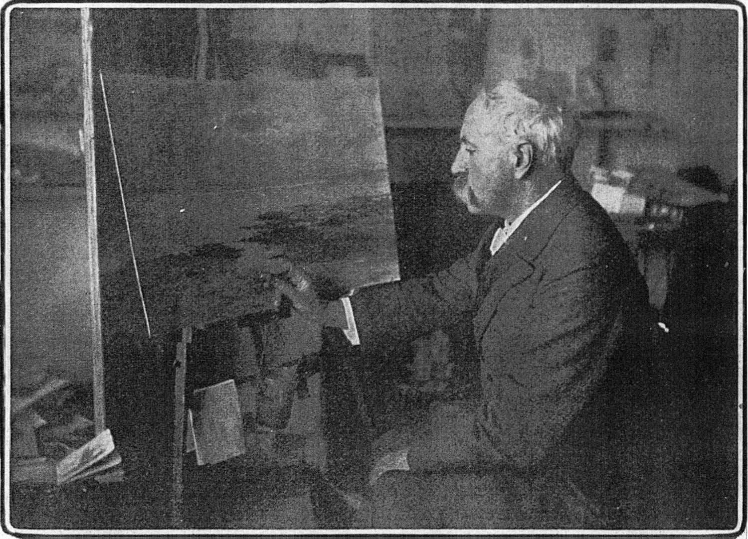 Percy French photographed in January 1906 painting with a shaving brush